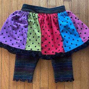 Kidcosmic Polka Dot Sequin Skirt Over Rainbow Striped Black Leggings - 2T